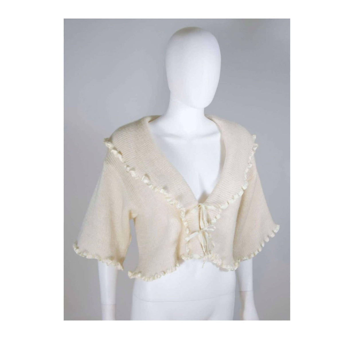 Pre-Owned CHRISTIAN DIOR Cashmere Tie Front Sweater with Ruffled Edges | Size 6 - theREMODA