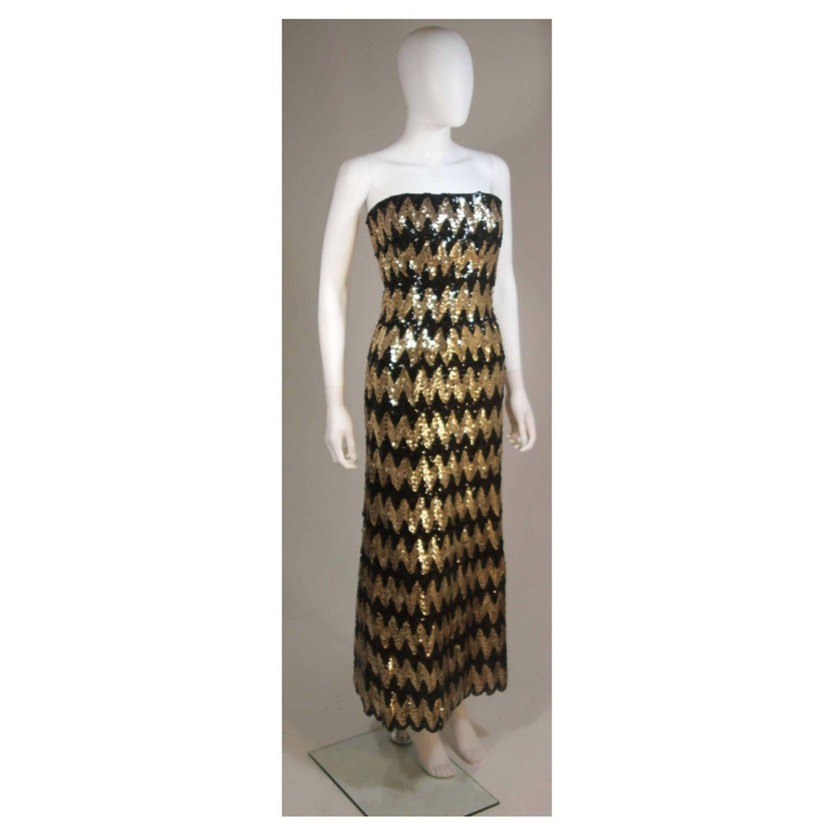 Pre-Owned ARNOLD SCAASI Strapless Black and Gold Knit Sequin Gown | Size US 2-4 - theREMODA